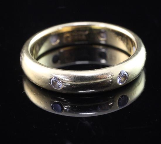 A modern Cartier 18ct gold and gypsy set diamond wedding band, size M.